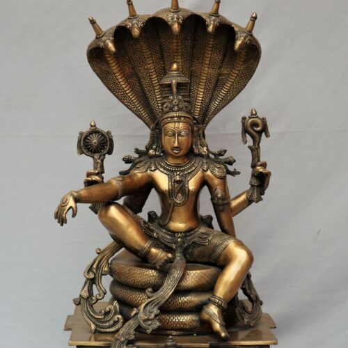 Brass Vishnu statue sitting on Sesh Naag