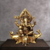 Brass ganesh statue sitting on gajapati