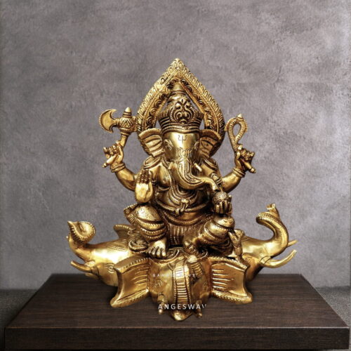 Brass ganesh statue sitting on gajapati