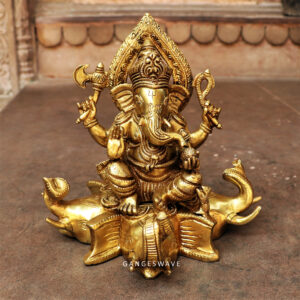 Brass ganesh statue sitting on elephant