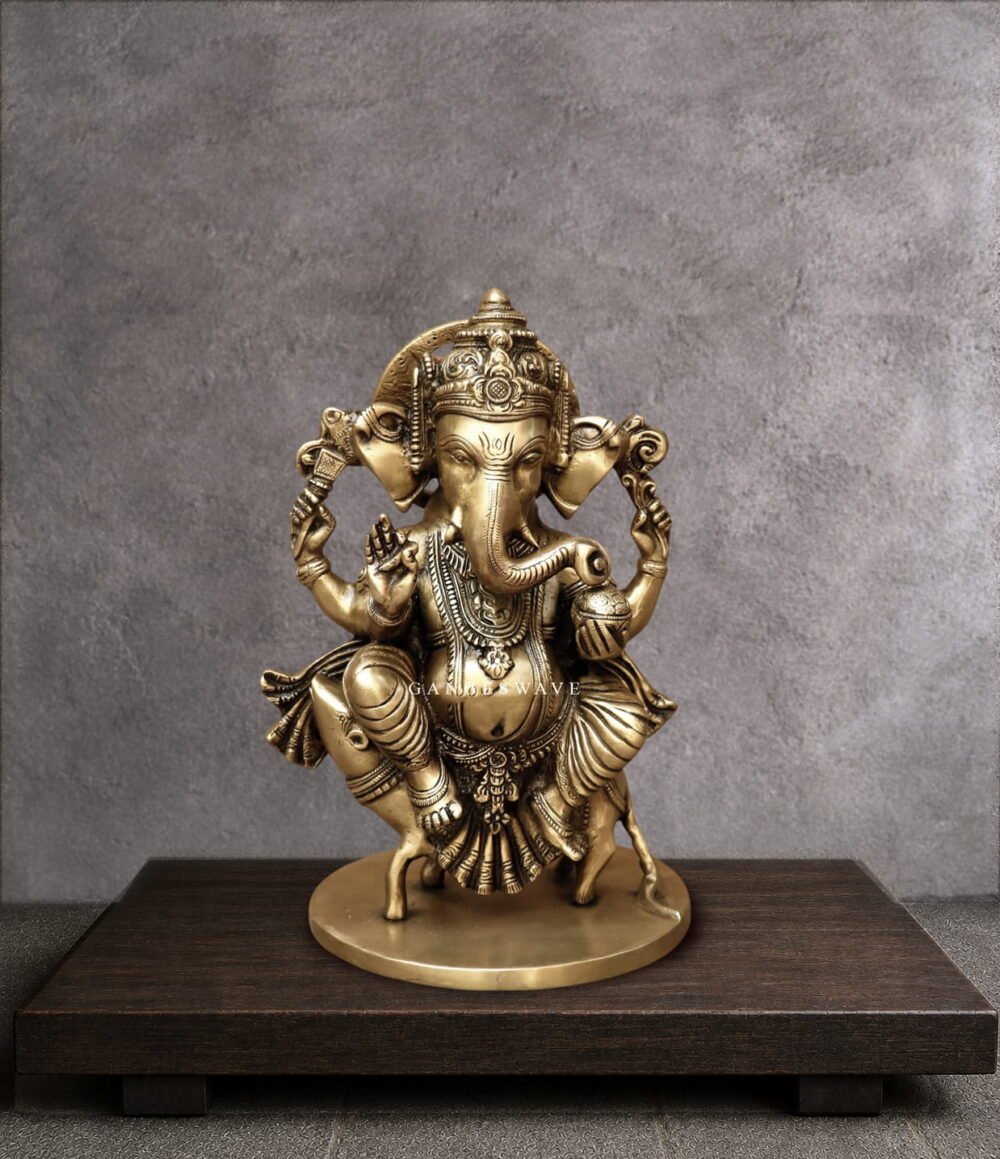 11" Ganesha Statue sitting on musak