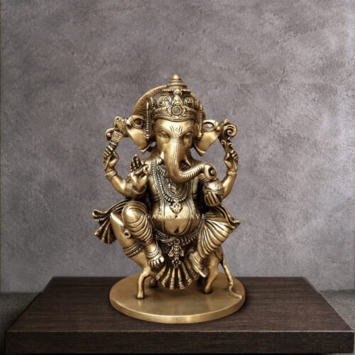11" Ganesha Statue sitting on musak