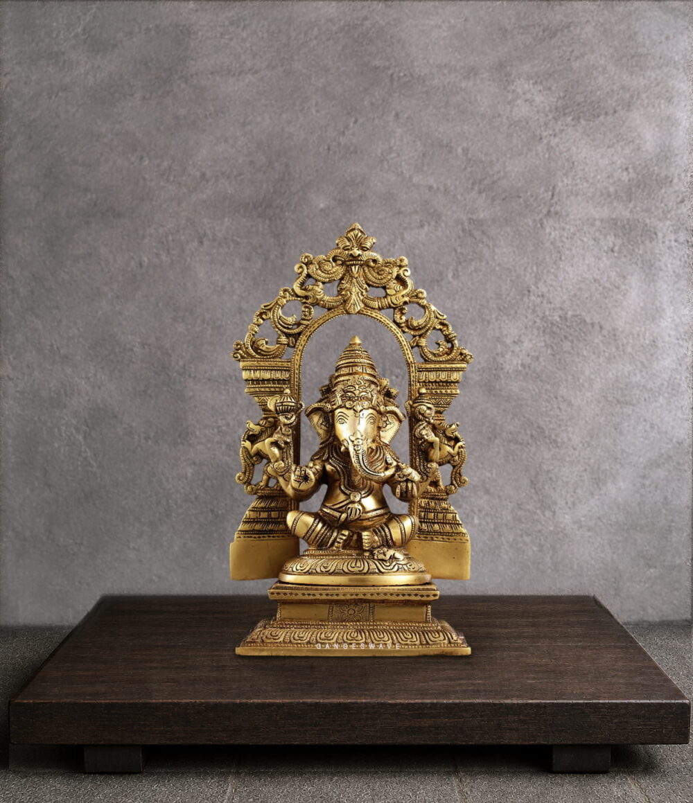Handcrafted Brass Ganesha Statue with ornate Prabhavali arch, premium solid brass idol for home temple, office décor, pooja room, meditation space, and luxury interiors.