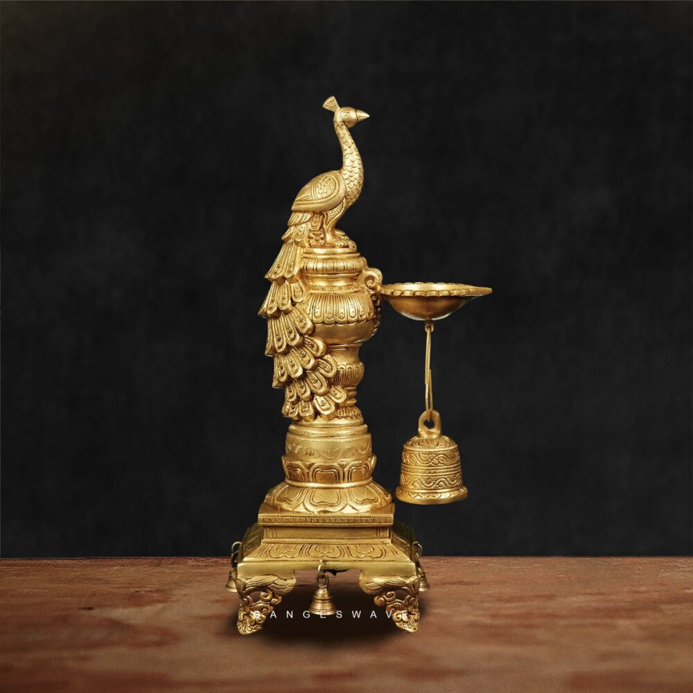 Handcrafted brass oil lamp with peacock design and hanging bells