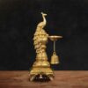 Handcrafted brass oil lamp with peacock design and hanging bells