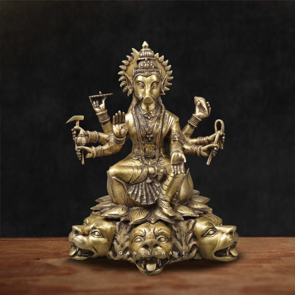 Religious brass idol Varaha Vishnu sitting on lotus base with lions