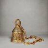 Handcrafted brass temple bell with intricate Ganesha carvings and ornate brass chain