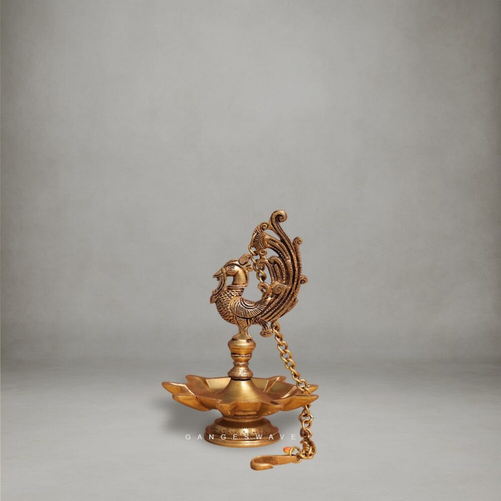 Handcrafted Brass Peacock Diya with intricate carving and hanging chain