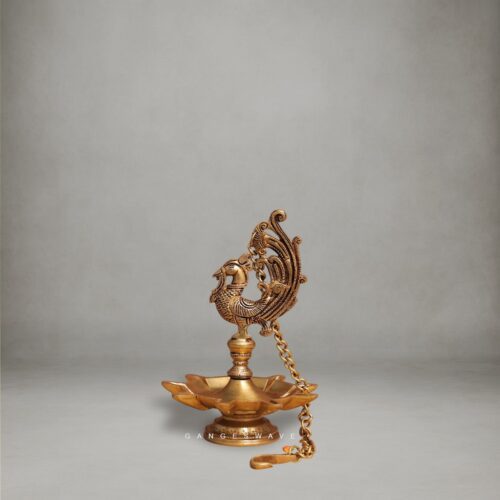 Handcrafted Brass Peacock Diya with intricate carving and hanging chain