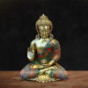 Colorful brass Buddha statue with stone inlay