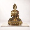 Handcrafted brass Buddha statue with multicolor stone inlay in meditative posture