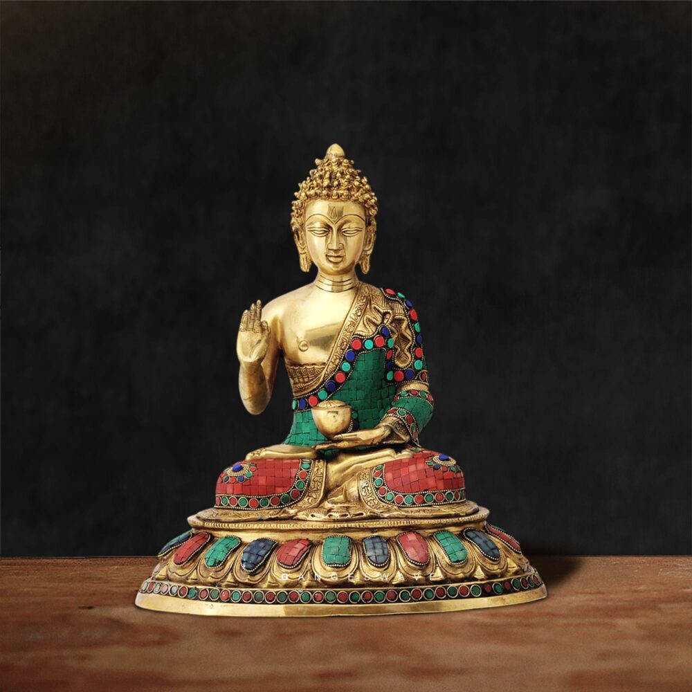 Handcrafted brass Buddha statue with semi-precious stone inlay work in blessing posture on ornate pedestal