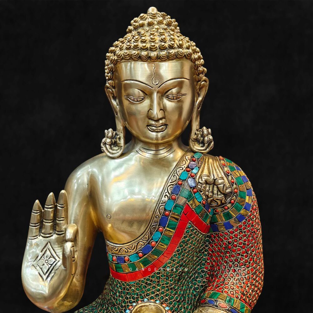 Colorful brass Buddha statue with stone inlay