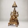 Premium brass Ganesh idol seated under decorative canopy with antique finish