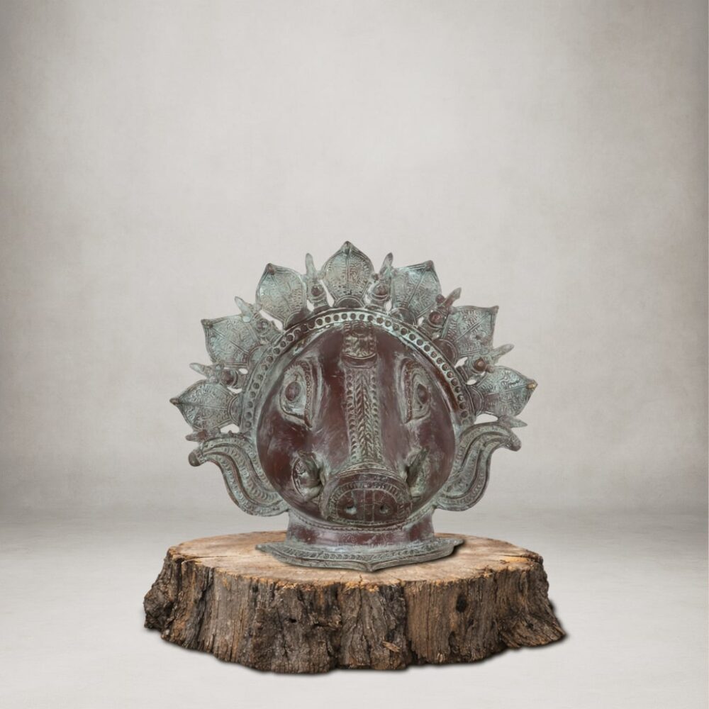 Handcrafted vintage finished brass Varaha mask representing Lord Vishnu’s boar avatar for spiritual wall décor.