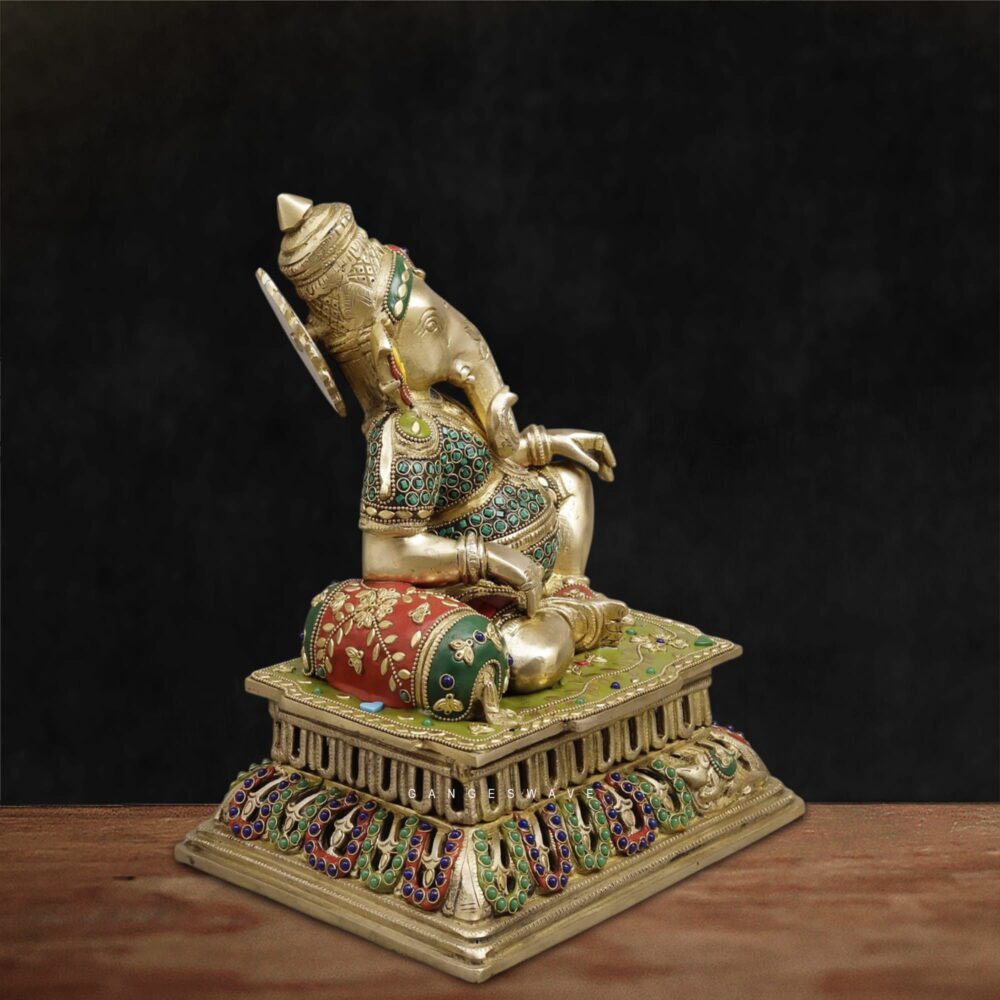 Antique finish reclining Lord Ganesha brass murti with jeweled pedestal