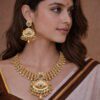 Traditional Gold-Finish Kundan Necklace Set with Semi-precious Stones & Jhumka Earrings