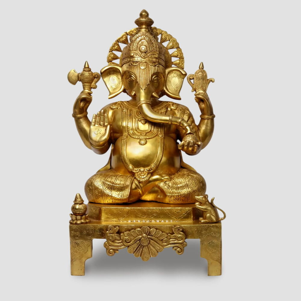 Handcrafted superfine brass Lord Ganesha statue with intricate carvings seated on an ornate throne, luxury Indian brass idol for home temple and premium interior décor.