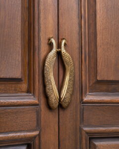 Luxury handcrafted antique brass peacock door handle pair with intricate feather engraving for premium wooden entrance doors