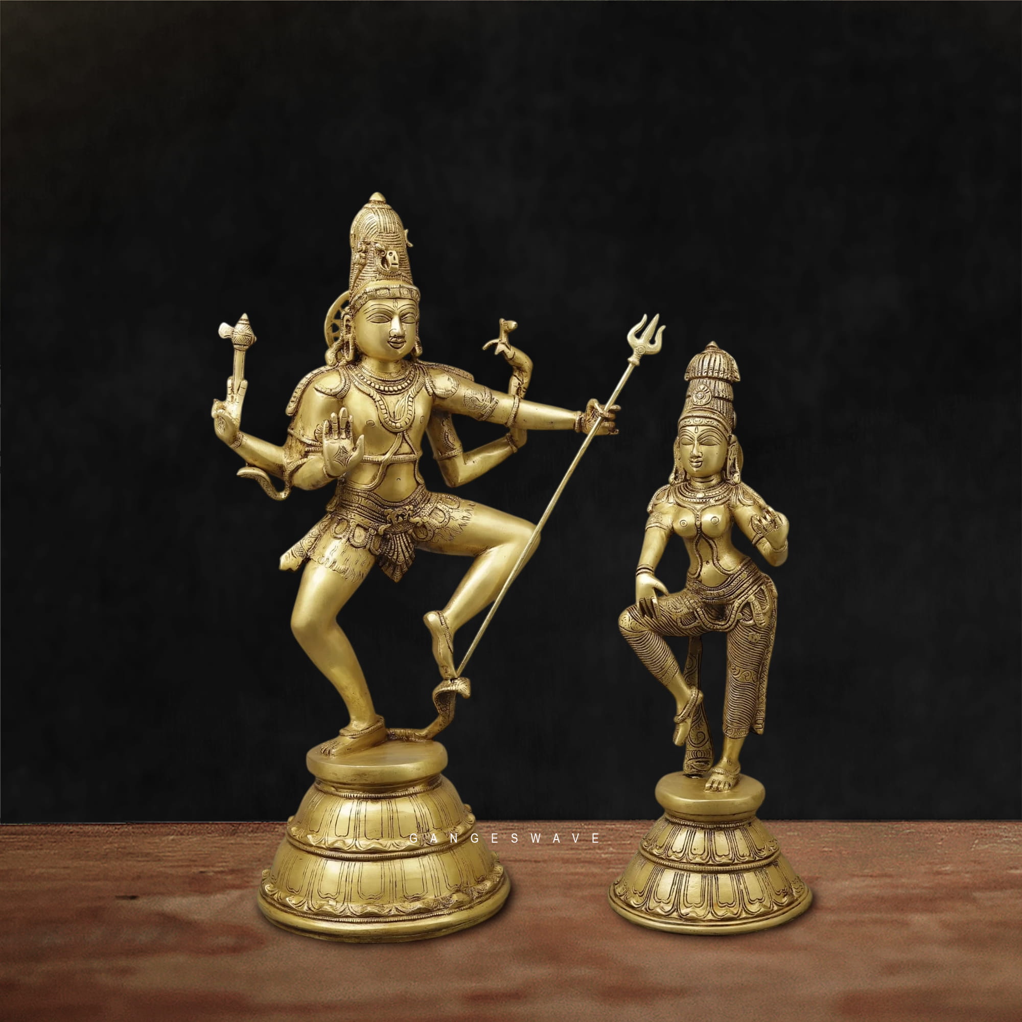 Handcrafted solid brass Nataraja and Parvati statue set featuring Lord Shiva in cosmic dance and Goddess Parvati in graceful posture for home temple, meditation space, and luxury home décor.