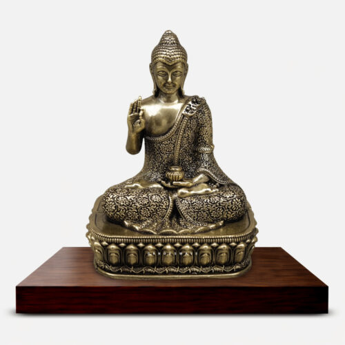 Handcrafted antique brass meditating Buddha statue with intricate floral engraving seated on an ornamental lotus pedestal for home décor and meditation.