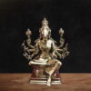 Handcrafted superfine brass Varahi Devi statue seated in meditative posture with multiple arms holding symbolic weapons, detailed antique finish Hindu goddess idol for home temple decor.