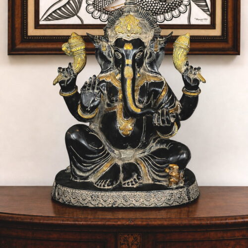 Handcrafted black brass Lord Ganesha idol with silver and gold detailing for luxury home temple décor.