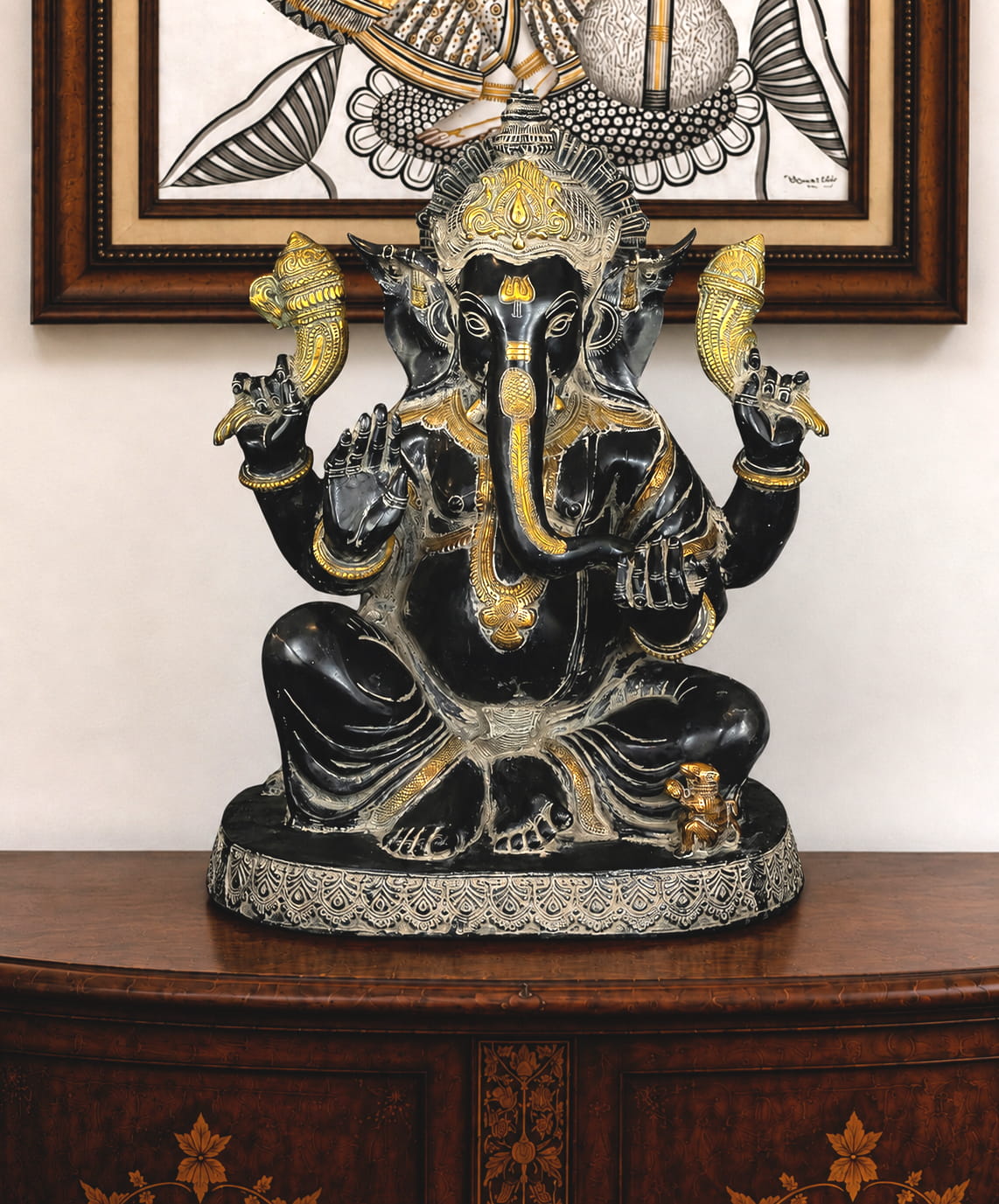 Handcrafted black brass Lord Ganesha idol with silver and gold detailing for luxury home temple décor.