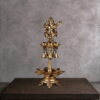 Antique brass dancing Ganesha diya with hanging bells and multi-tier oil lamp bowls, handcrafted Nritya Ganapati statue for Hindu puja and aarti