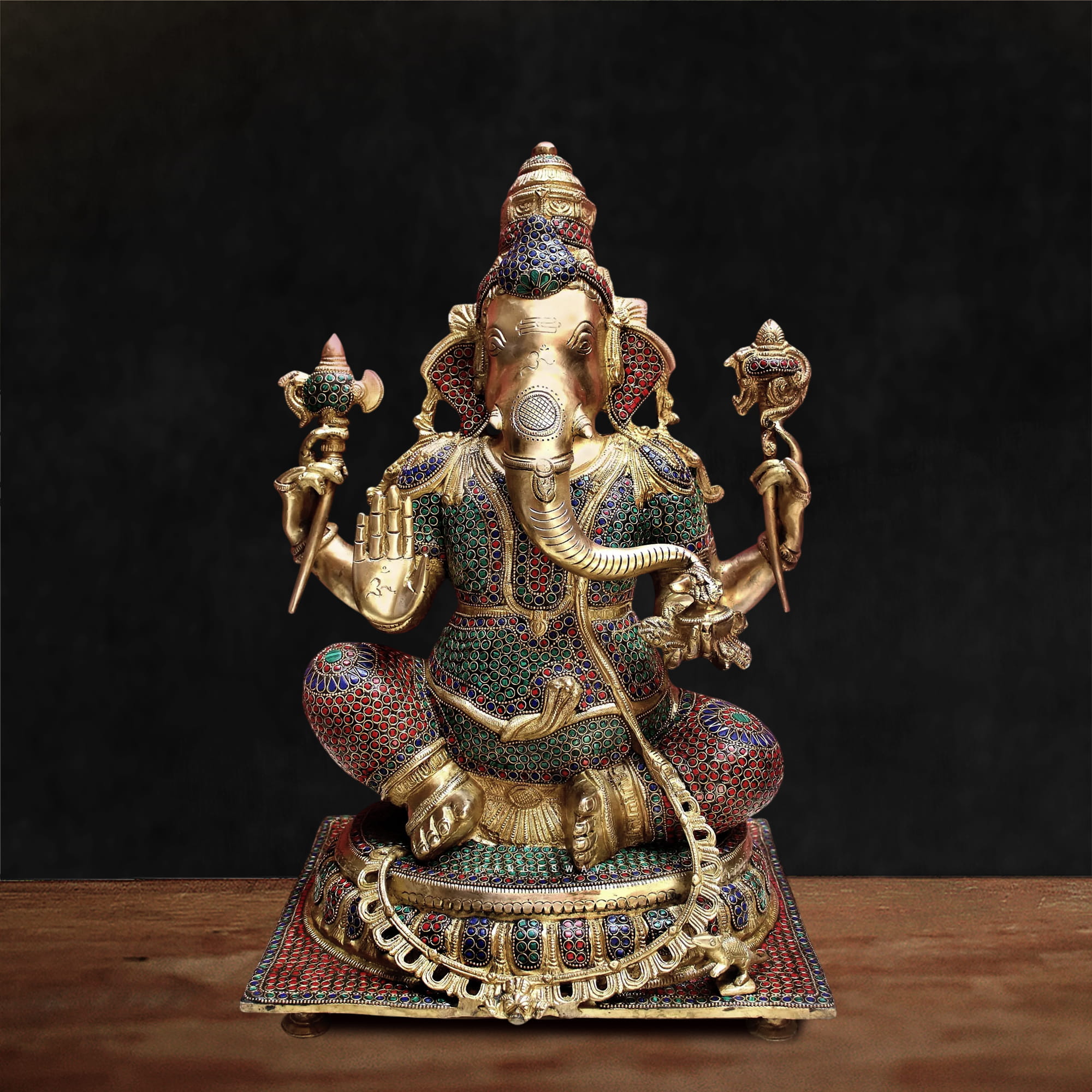 Handcrafted Brass Meenakari Ganesha Statue featuring intricate multicolour enamel work, antique brass finish, and traditional Indian craftsmanship for luxury home décor and pooja.
