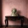 Handcrafted brass Green Tara bust statue with antique verdigris finish displayed as luxury spiritual home décor