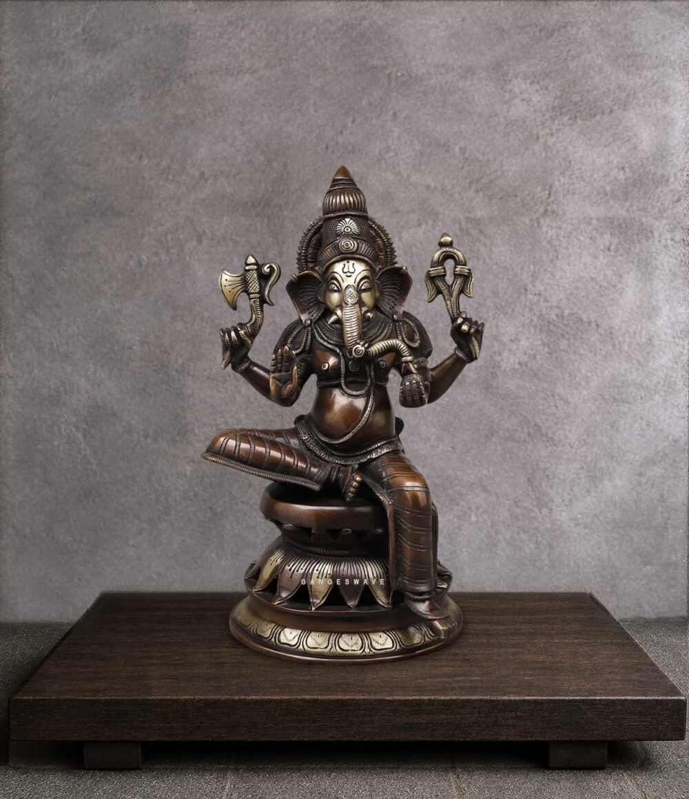 Handcrafted vintage finish brass Ganesha statue with intricate detailing, seated on a lotus pedestal for home temple, office décor and spiritual interiors.