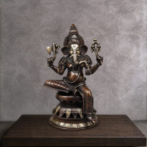 Handcrafted vintage finish brass Ganesha statue with intricate detailing, seated on a lotus pedestal for home temple, office décor and spiritual interiors.