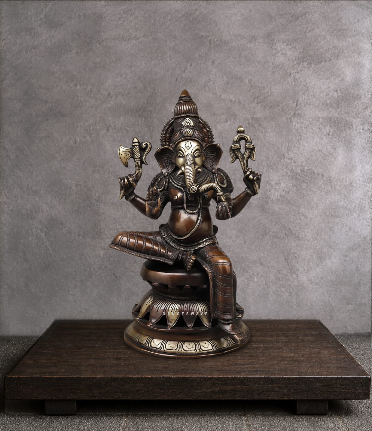 Handcrafted vintage finish brass Ganesha statue with intricate detailing, seated on a lotus pedestal for home temple, office décor and spiritual interiors.