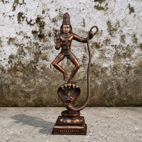 Handcrafted brass statue of Krishna dancing on the hooded serpent Kaliya, antique bronze finish