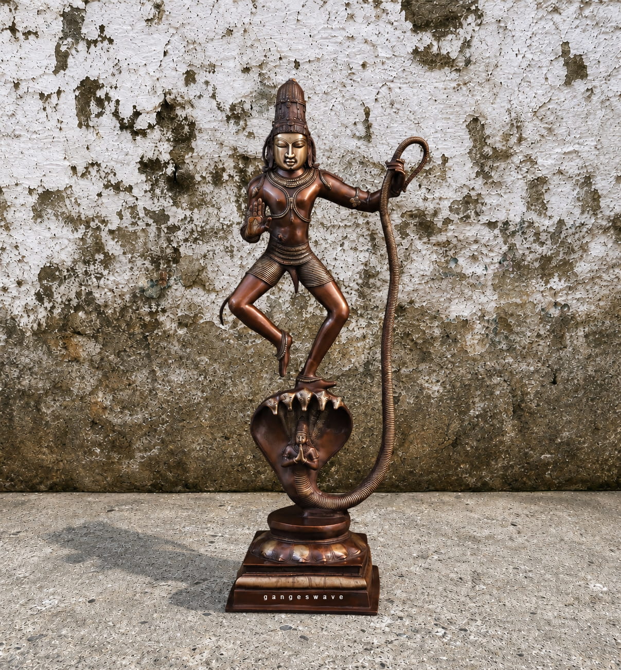 Handcrafted brass statue of Krishna dancing on the hooded serpent Kaliya, antique bronze finish