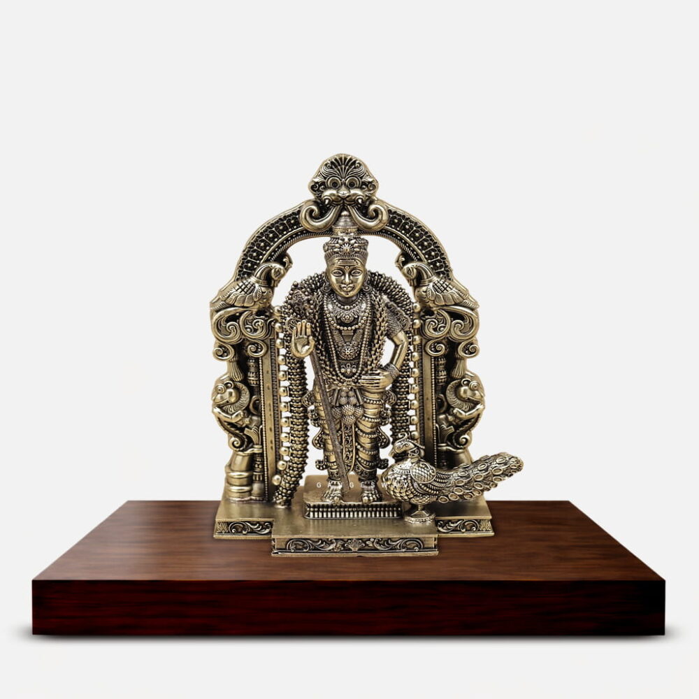 Handcrafted superfine brass Lord Murugan idol with ornate temple arch and peacock in antique finish for home temple, luxury décor and spiritual gifting.