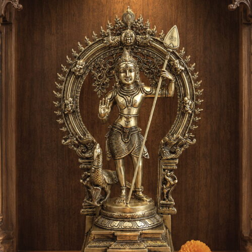 Handmade premium solid brass Lord Murugan statue with sacred Vel, ornate Prabhavali arch and peacock for home temple, spiritual décor and luxury interiors.