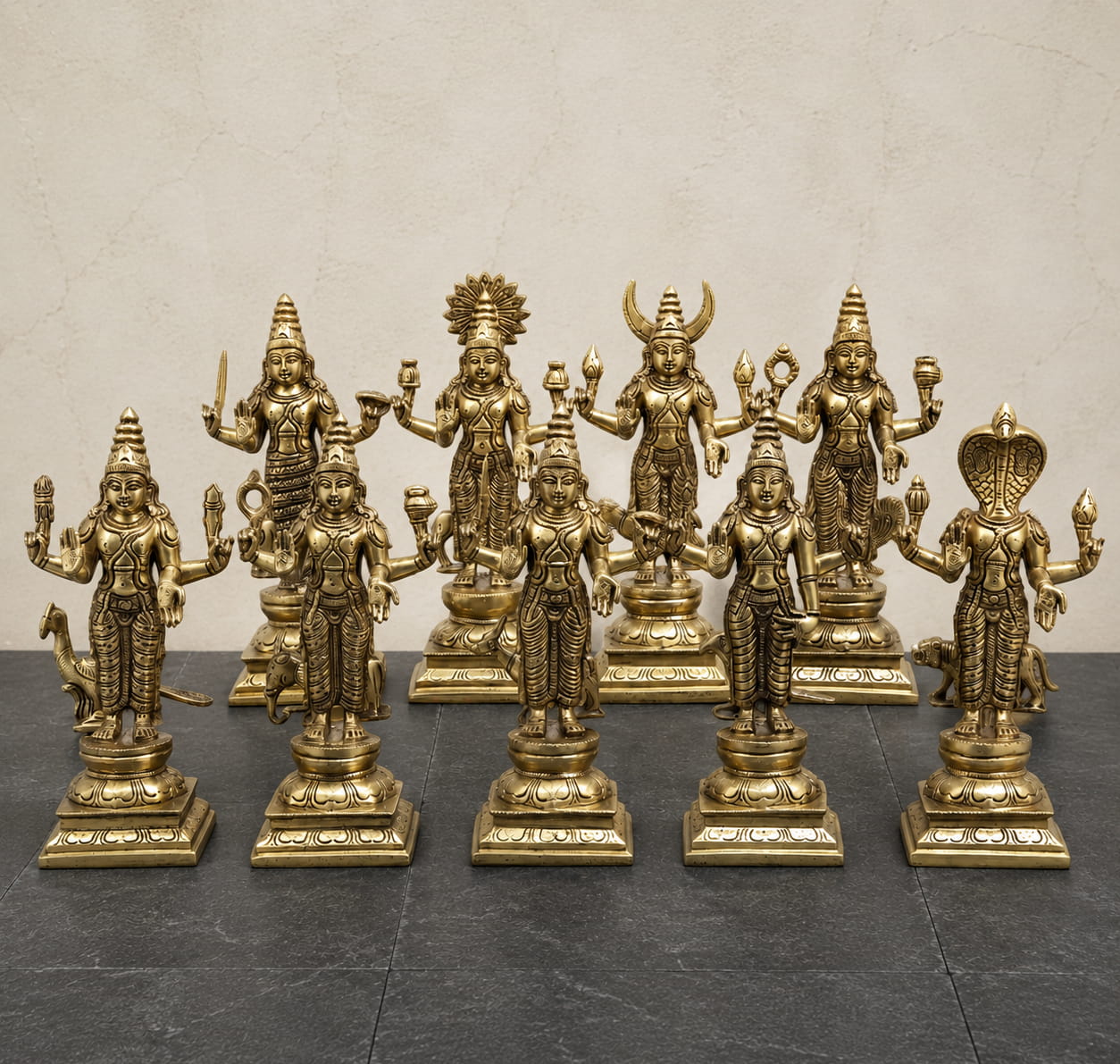 Premium handcrafted Brass Navagraha Idol Set featuring nine individually crafted planetary deities on lotus pedestals for home temple, Navagraha pooja, Vastu, and temple installation.