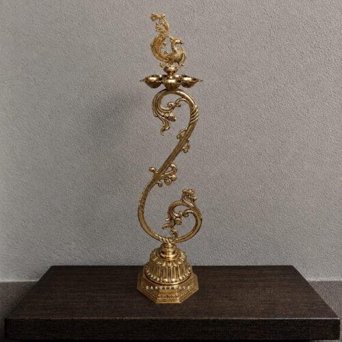 Brass peacock diya stand with multiple diya holders and ornate traditional detailing