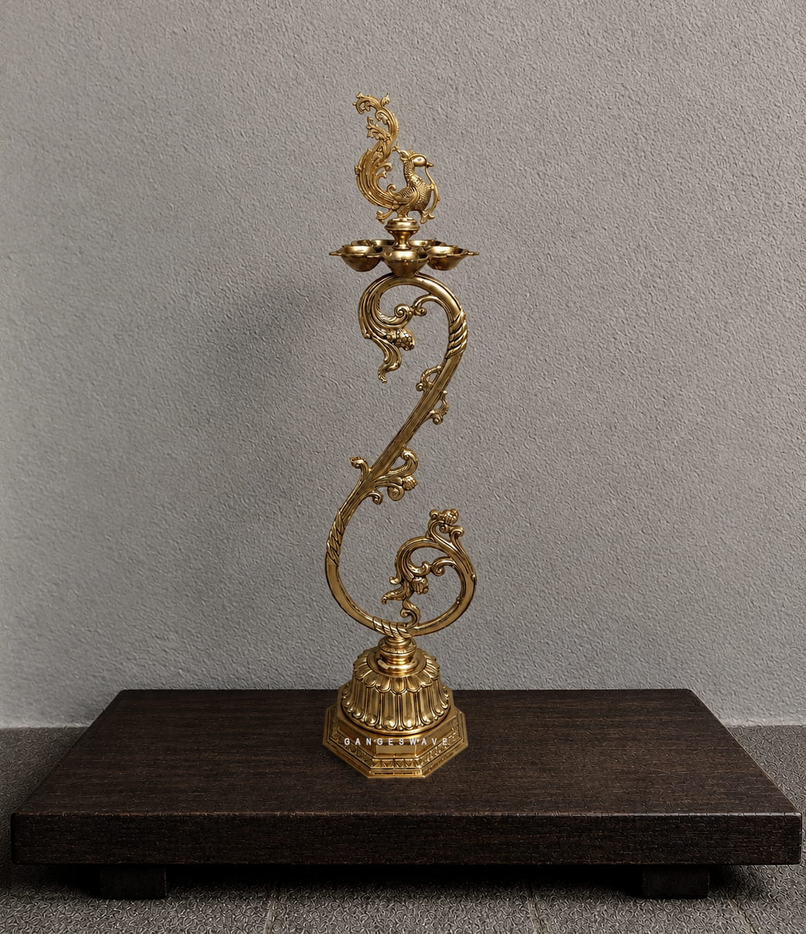 Brass peacock diya stand with multiple diya holders and ornate traditional detailing