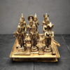 Premium handcrafted brass Navagraha statue set featuring nine planetary deities on an engraved brass pedestal for home temple, pooja and Vastu.