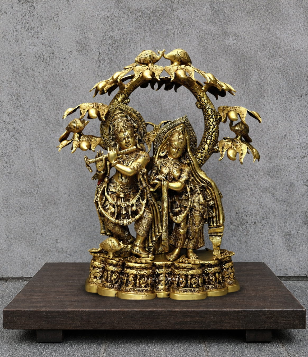Radha Krishna brass statue under a Kadamba tree with Krishna playing flute