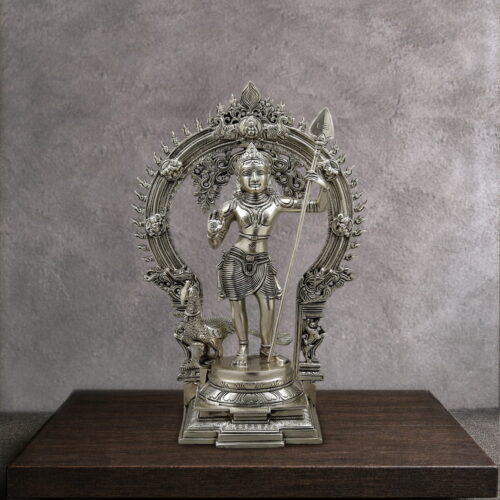 Handmade premium solid brass Lord Murugan statue with sacred Vel, ornate Prabhavali arch and peacock for home temple, spiritual décor and luxury interiors.