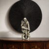Seated Sai Baba idol in blessing pose with circular radial halo