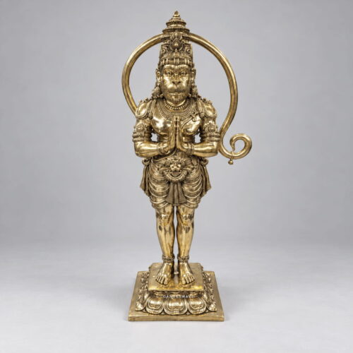 Standing brass Hanuman statue with folded hands, ornate crown and lotus pedestal