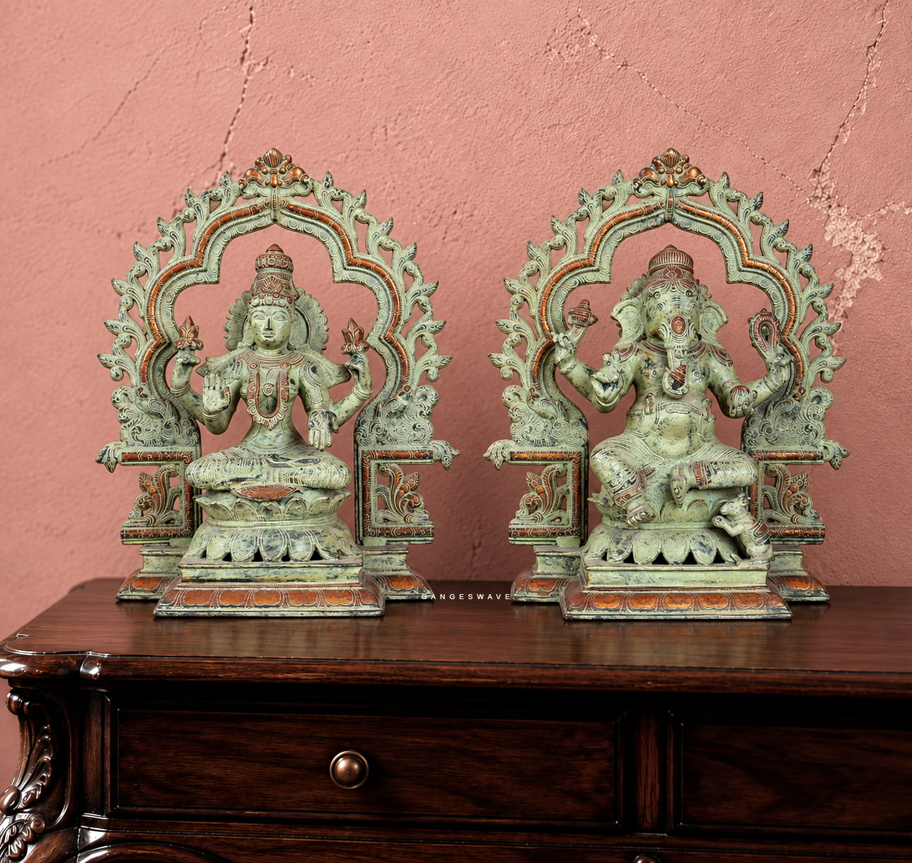 Antique green patina brass Lakshmi Ganesha statue pair with ornate traditional arches