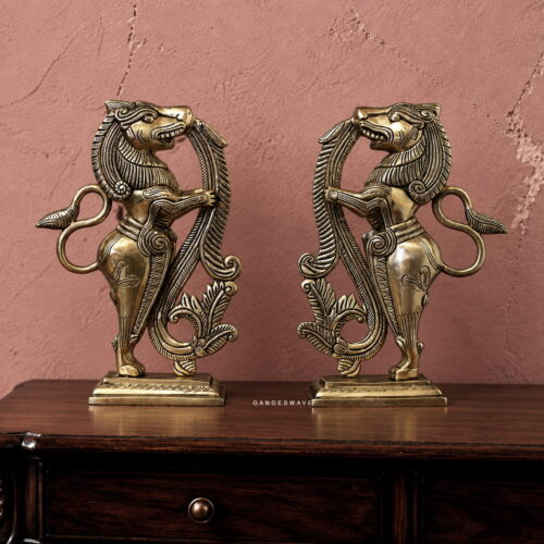 Pair of vintage-style brass Yali sculptures with intricate detailing and antique-gold finish