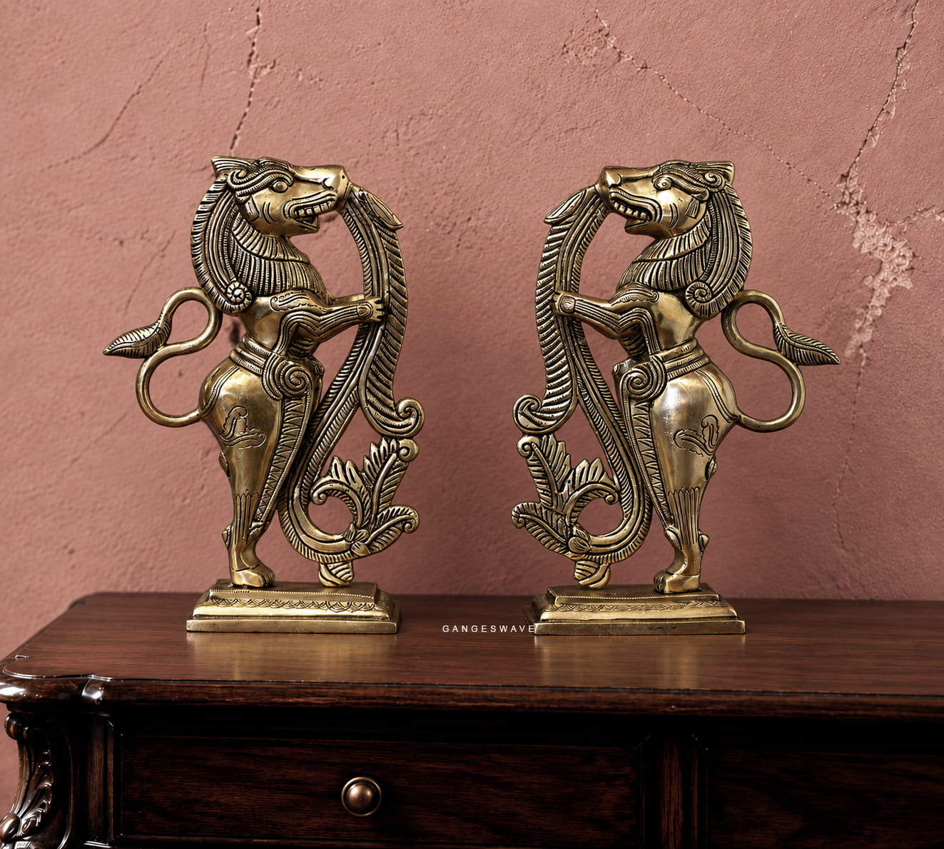 Pair of vintage-style brass Yali sculptures with intricate detailing and antique-gold finish
