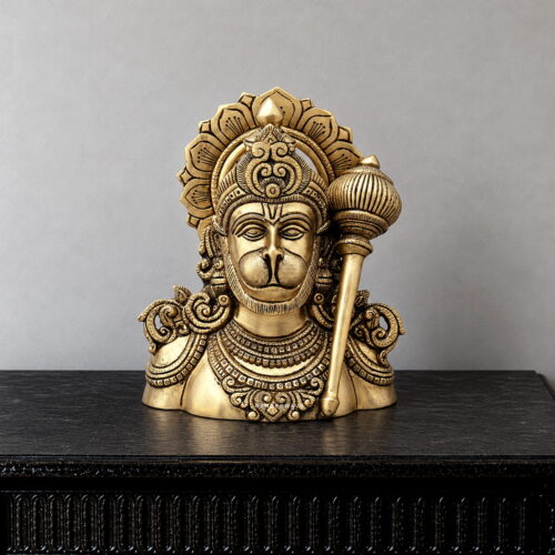 Brass Hanuman Ji bust with ornate crown, decorative jewellery and gada in an antique gold-toned finish.